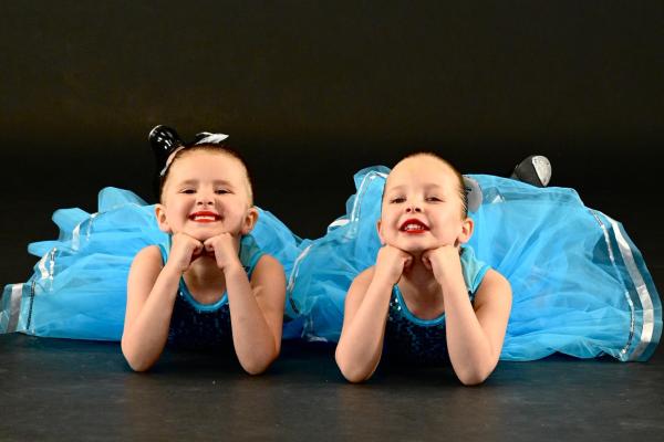 Two young dancers in blue tutus