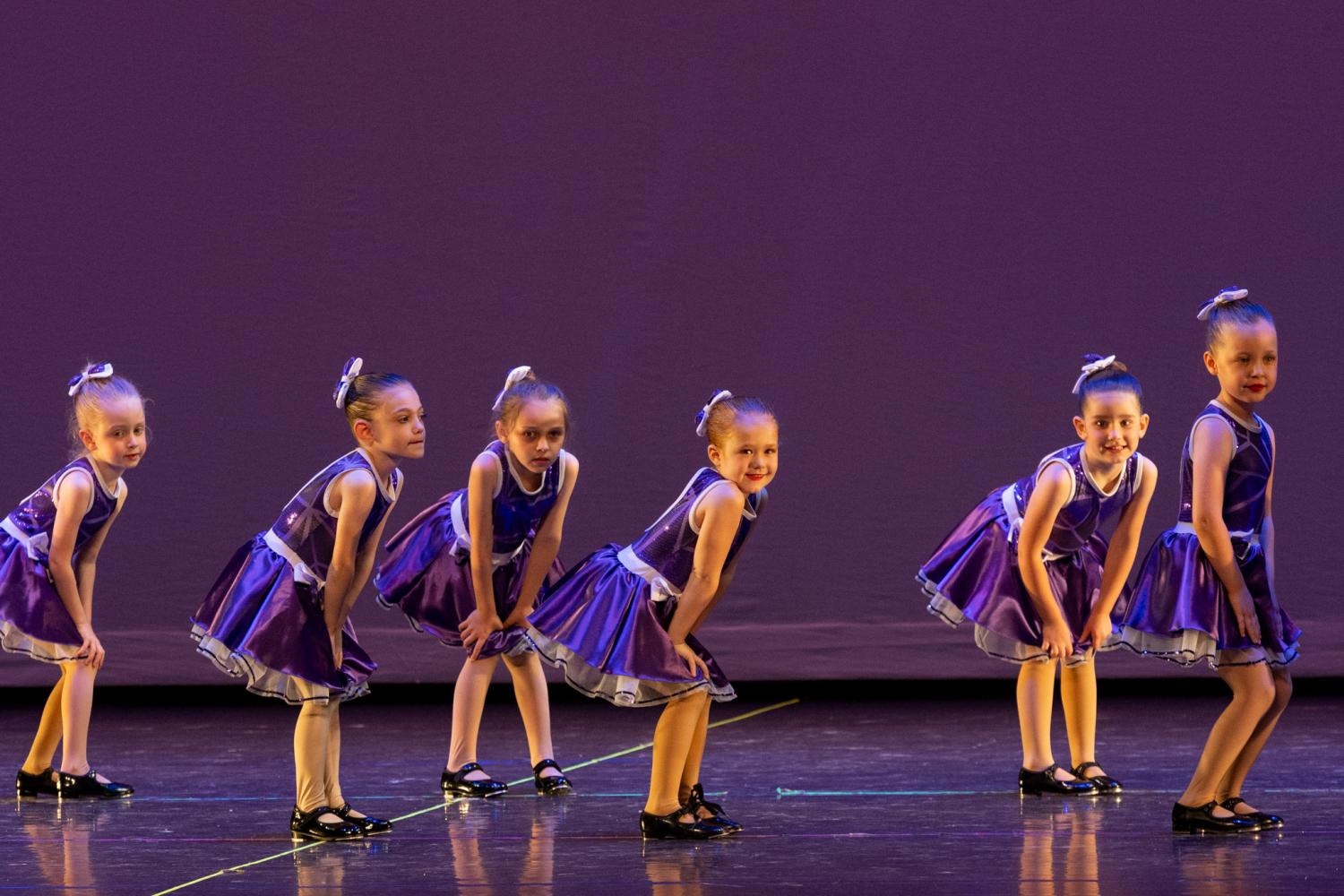 Young Tap Dancers in Purple Dresses